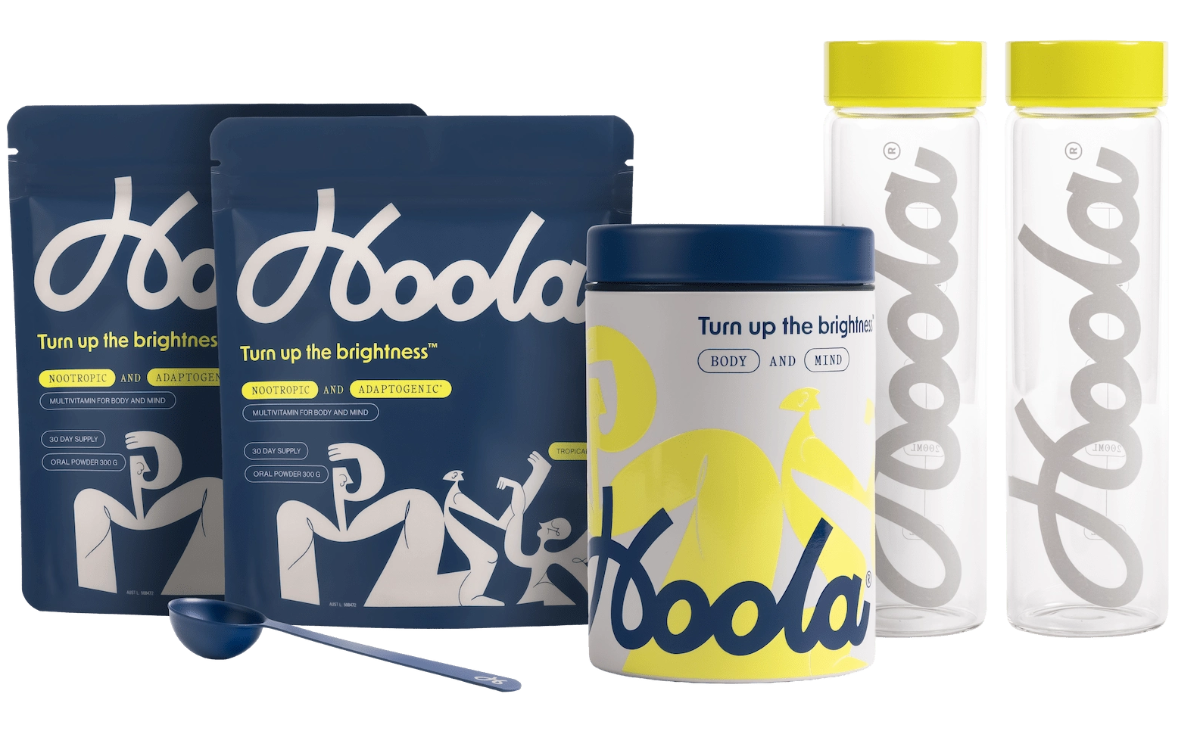 Hoola supplement packaging including powder packets, a container, and bottles on a white background.